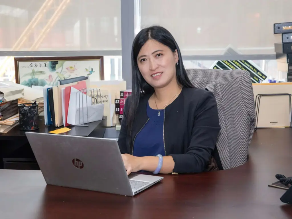 alt="Professional headshot of Louisa Wu, Attorney at Law, a bilingual attorney specializing in family law and immigration for the Asian community in New York."